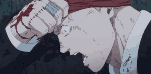 a man with a bandage on his head is holding a knife in his hand