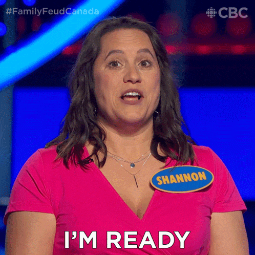 a woman in a pink shirt with the name shannon on her shirt says i 'm ready