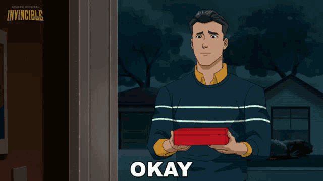 a cartoon of a man holding a red box with the word okay below him