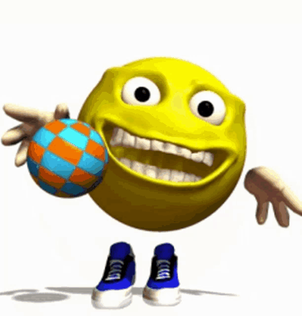 a yellow smiley face is holding a blue and orange ball in its mouth