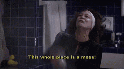 a woman in a bathroom with the words this whole place is a mess