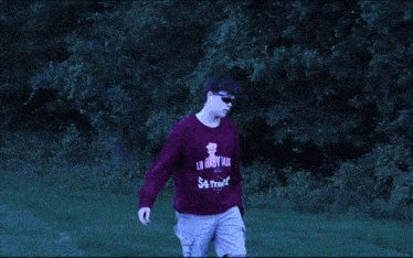 a person 's legs are shown in a blurry photo while they are walking on a trampoline