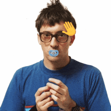 a man with a pacifier in his mouth has a hand on his head