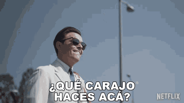 a man wearing sunglasses says " que carajo haces aca " in spanish