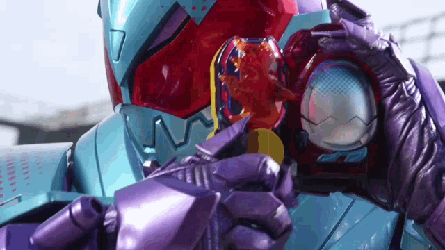 a close up of a person holding a purple object