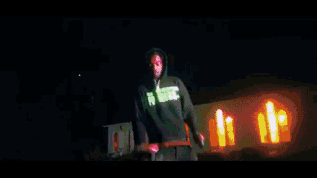 a man in a black hoodie with the number 27 on the front