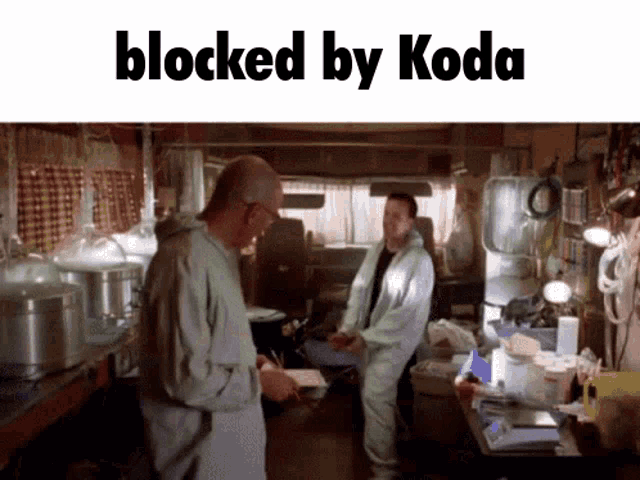 two men standing in a room with the words blocked by koda on the top