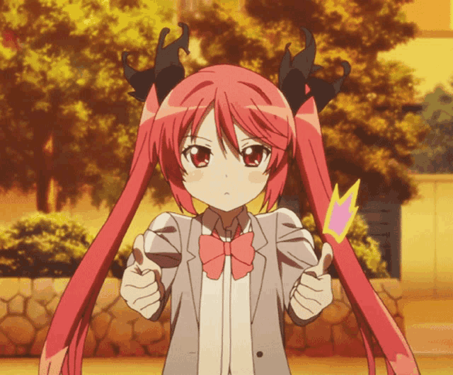 a girl with red hair and black horns giving a thumbs up