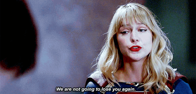 a woman in a superhero costume is talking to a man and says `` we are not going to lose you again ''