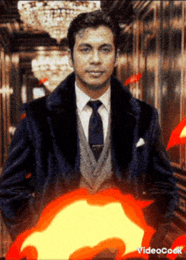 a man in a suit and tie is standing in a hallway with fire coming out of his jacket