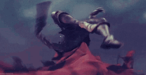 a pixelated image of a person with a red scarf around their face holding a gun