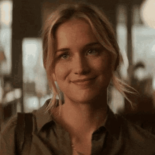 a close up of a woman 's face smiling .