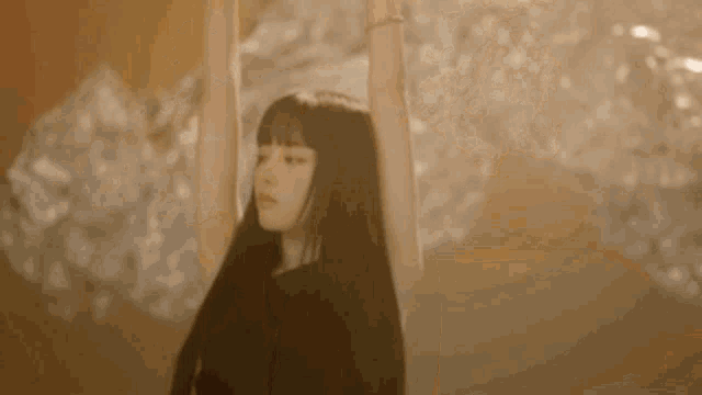 a woman with her arms in the air has the name yoon antizer written on the bottom