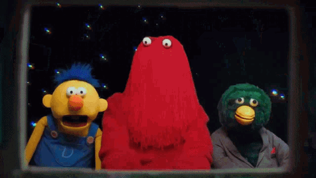 three sesame street puppets are standing next to each other in front of a star wars background