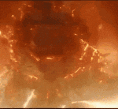 a close up of a fireball in a dark room .