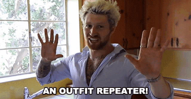 a man in a blue shirt says an outfit repeater in front of a window