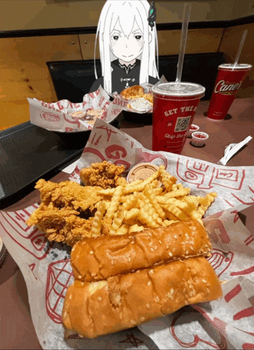a chicken sandwich with french fries and a drink that says get the a on it