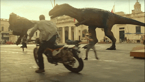 a man riding a motorcycle is being chased by a dinosaur
