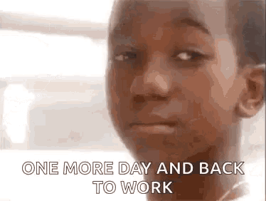a close up of a young boy 's face with the words `` one more day and back to work '' written on it .