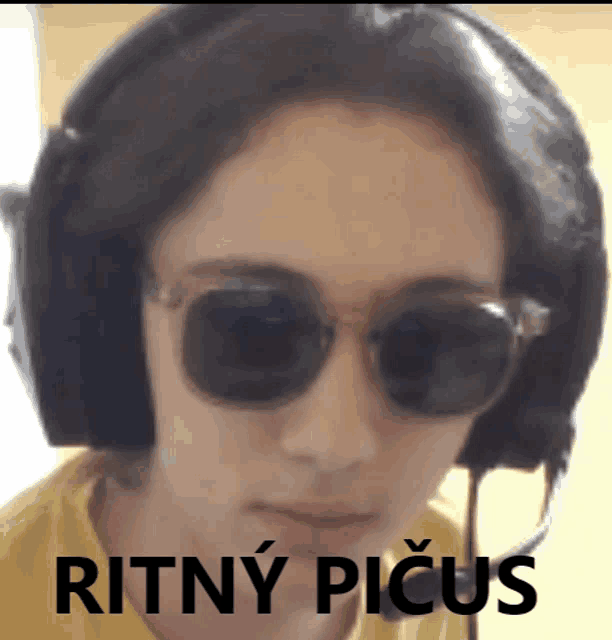 a person wearing headphones and sunglasses with the words ritny picus written on the bottom
