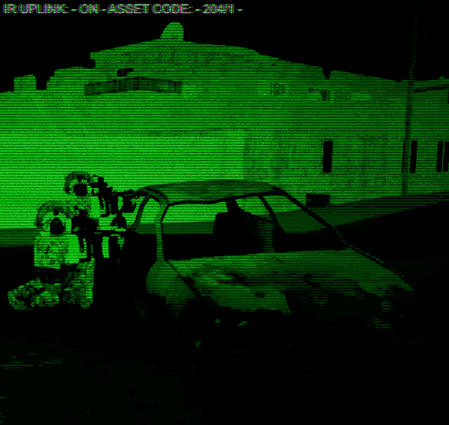 a green screen shows a car and a man with a gun in front of a building with the word asset code on it