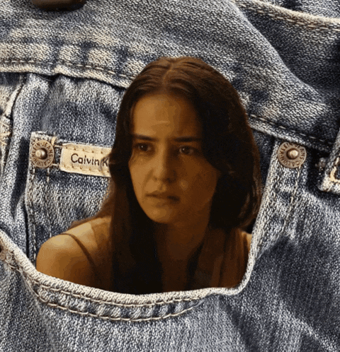 a woman 's face is visible in a pair of calvin klein jeans