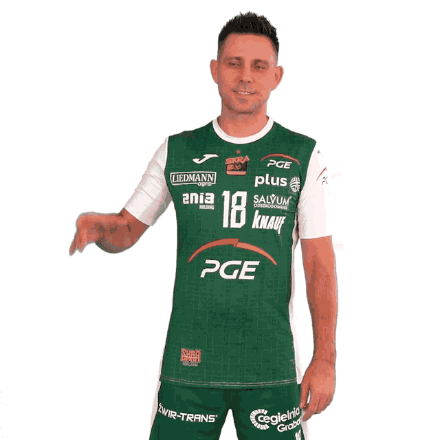 a man wearing a green and white shirt that says pge