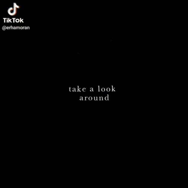 a tiktok video of a person standing in front of a window with a light shining through it .