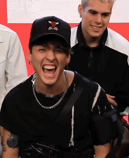 a man wearing a hat that says chicago bulls on it
