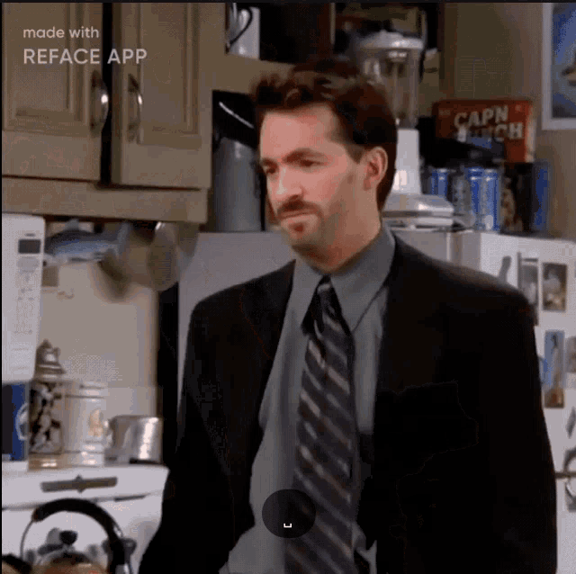 a man in a suit and tie is standing in a kitchen with a can of capn crunch in the background
