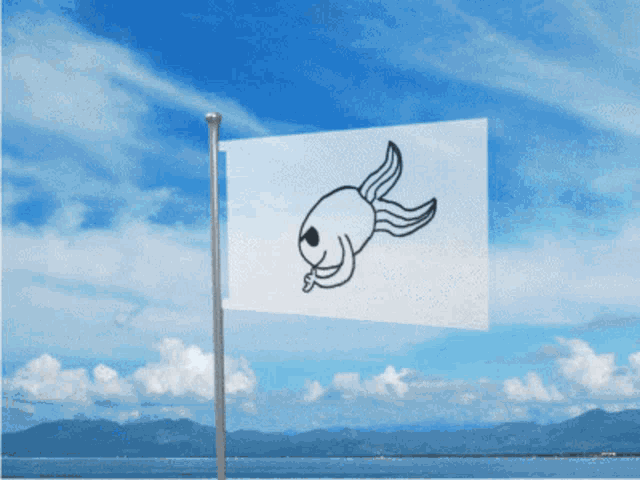 a flag with a fish on it flies in the wind
