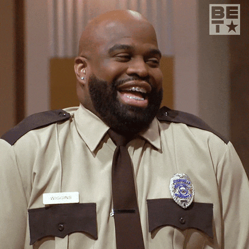 a man in a security uniform has a name tag that says wiggins