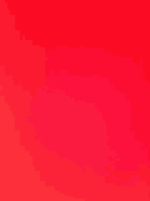 a close up of a red background with a gradient in the middle .