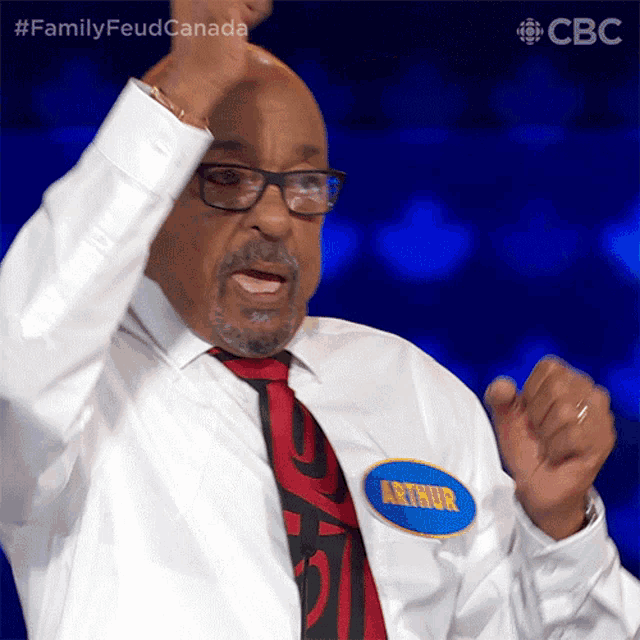 a man with a name tag that says arthur