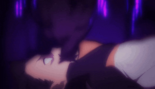 a man is laying on his back in a dark room with a purple light behind him .