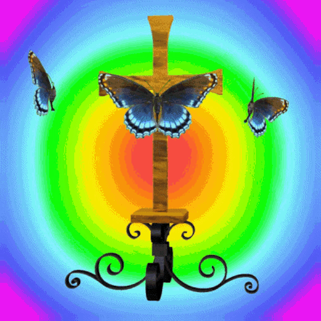 a cross with butterflies flying around it and a colorful background