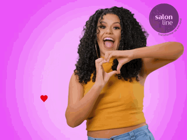 a woman with curly hair making a heart shape with her hands in front of a salon line logo