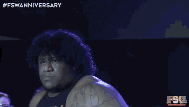 a man wearing a shirt that says ' fswaanniversary ' on it