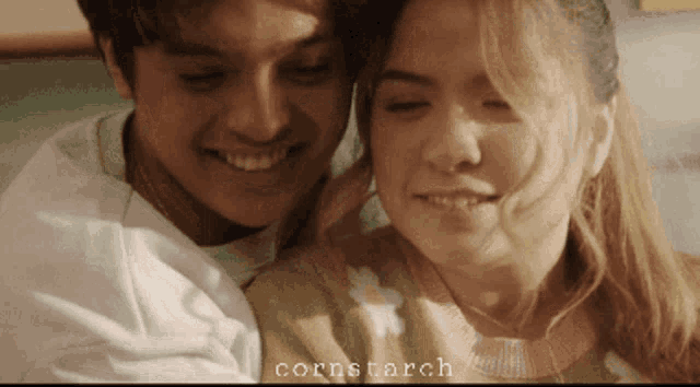 a close up of a man and woman with the words cornstarch on the bottom right