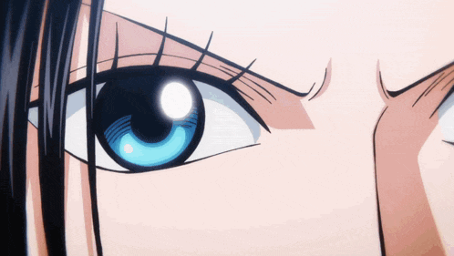 a close up of a woman 's blue eye