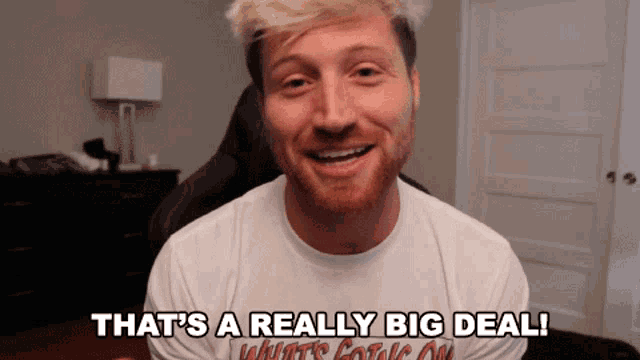 a man in a white shirt with the words that 's a really big deal