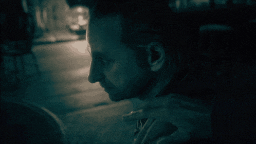 a man 's face is visible in a blurry photo