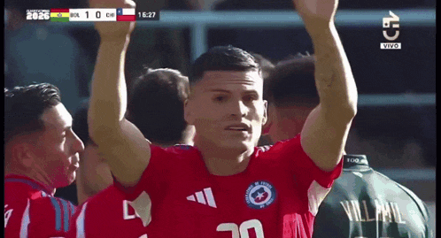a soccer player wearing a red jersey with the number 30 on it
