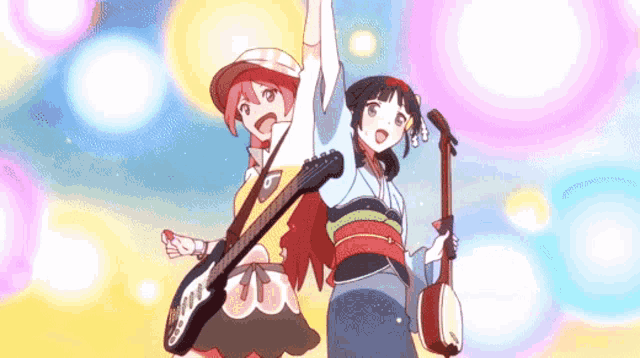 a girl holding a guitar and another girl holding a banjo are standing next to each other with their arms in the air