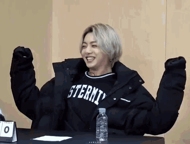 a person wearing a black jacket that says sterni