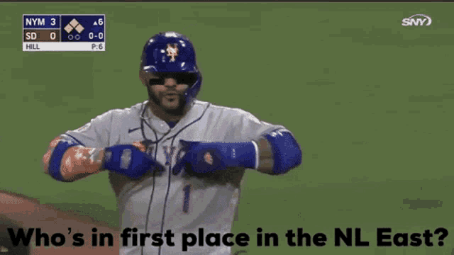 a baseball player for the new york mets is pointing at someone
