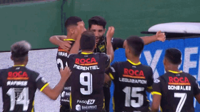 a group of soccer players wearing jerseys with roca merentiel on the back