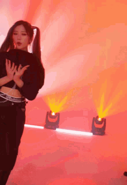 a woman wearing a black crop top with a waistband that says ' calvin klein ' on it