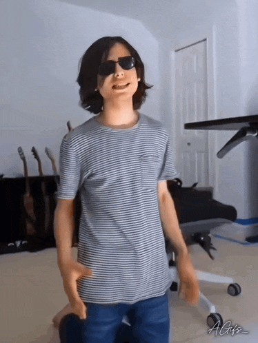 a man wearing sunglasses and a striped shirt with the name agis on the bottom right