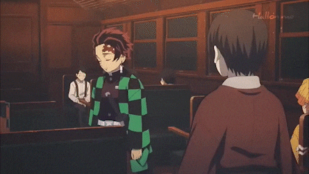a man is holding a girl in his arms in a room .